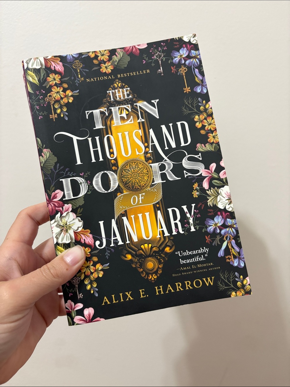 The Ten Thousand Doors of January by Alix E. Harrow — Black Floral Paperback